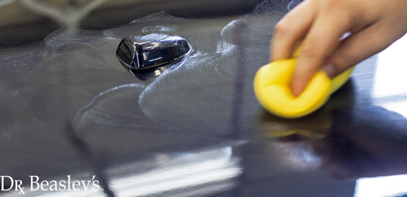 Applying Wax to Blue Car