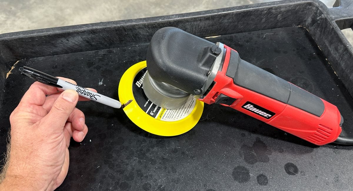 Marking a random orbital polisher backing plate to monitor pad stalling