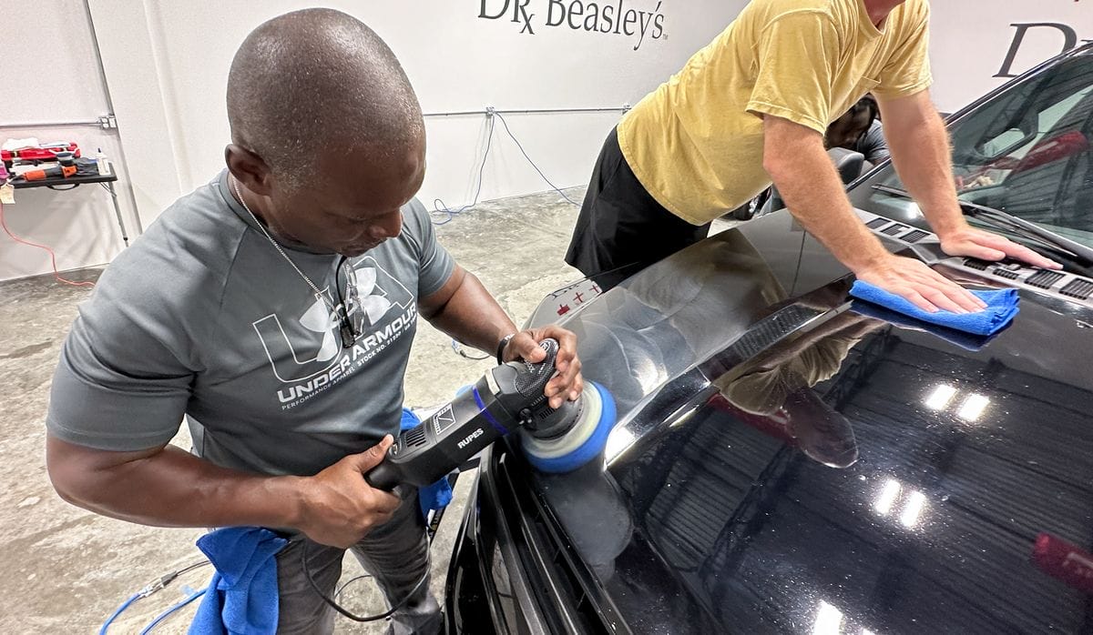Students learning in detailing class