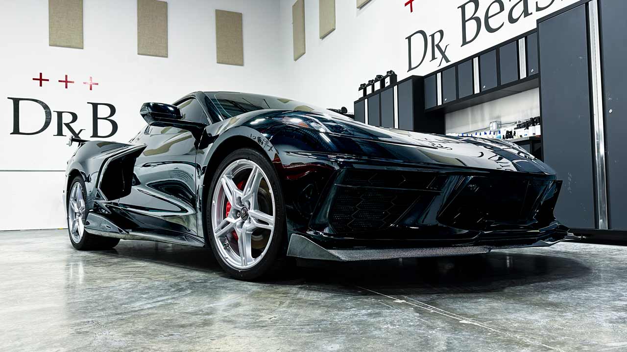 Black corvette with mirror finish