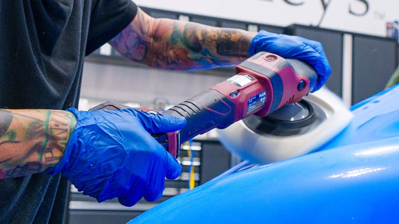 Compounding paint with a rotary polisher